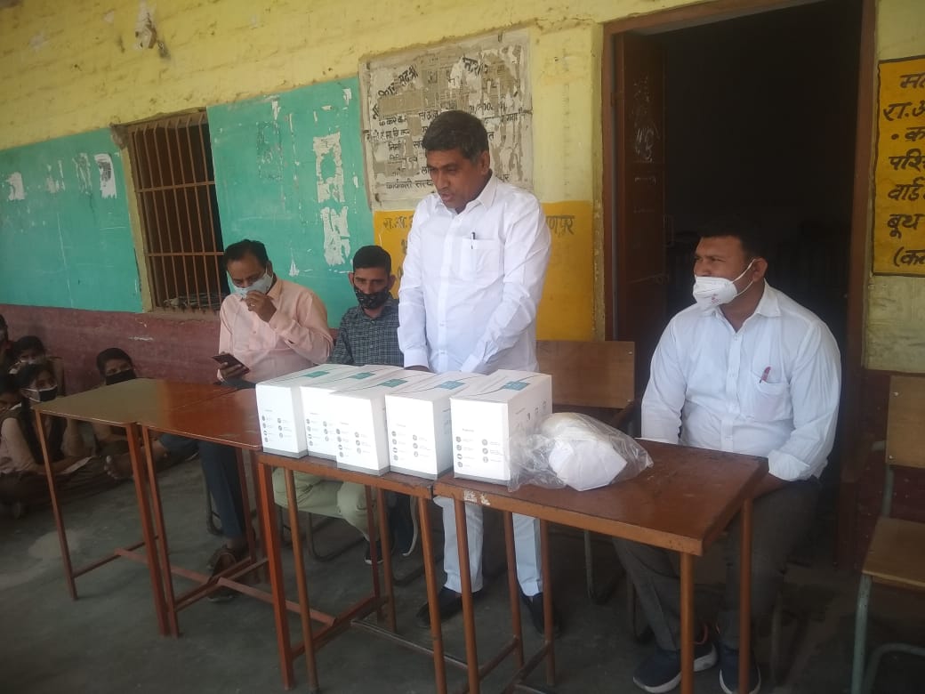 Volunteer handing over mask